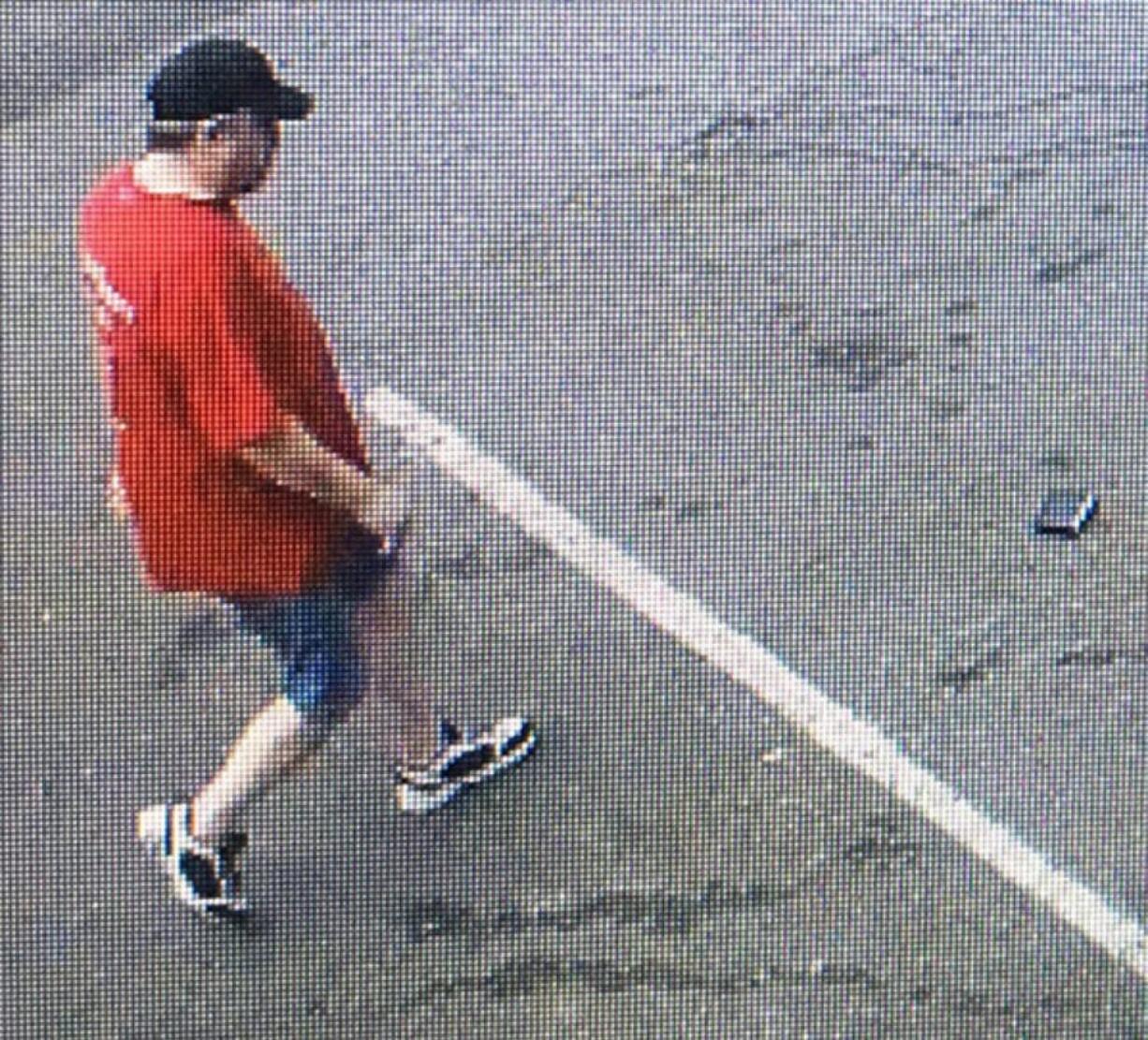 The Vancouver Police Department is looking for more information on a man, shown here in images taken from surveillance video, suspected of picking up and walking off with a dropped wallet.