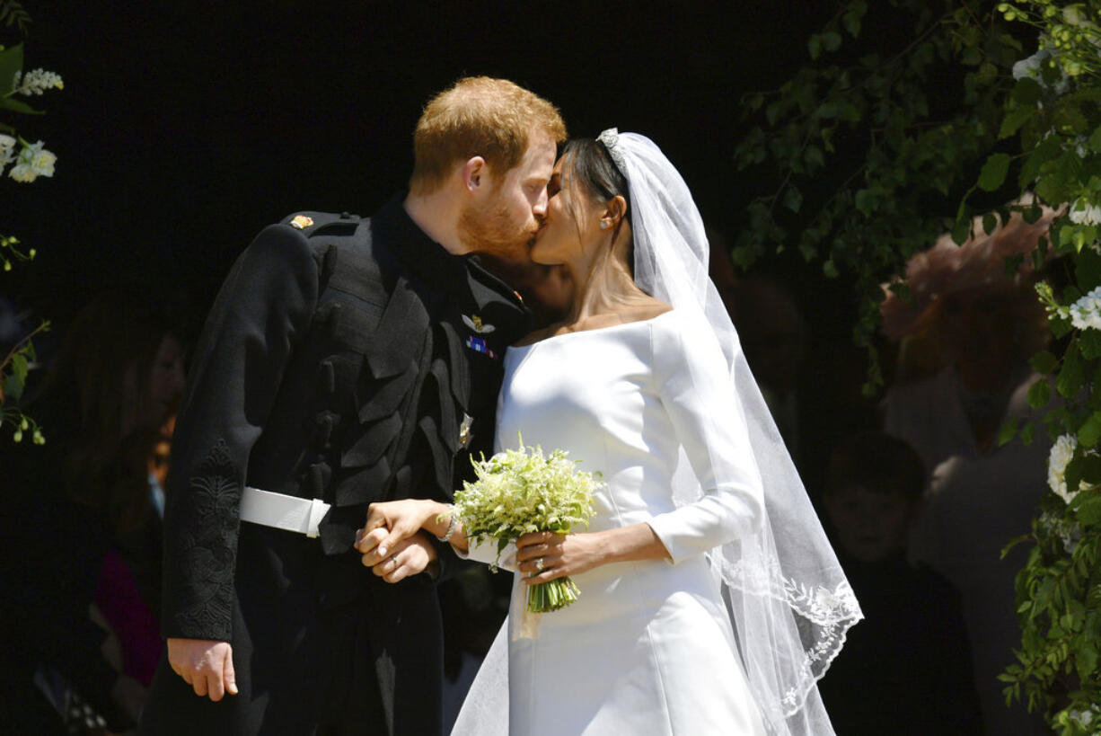 Prince Harry and Meghan Markle leave after their wedding ceremony at St. George's Chapel in Windsor Castle in Windsor, near London, England, Saturday, May 19, 2018.