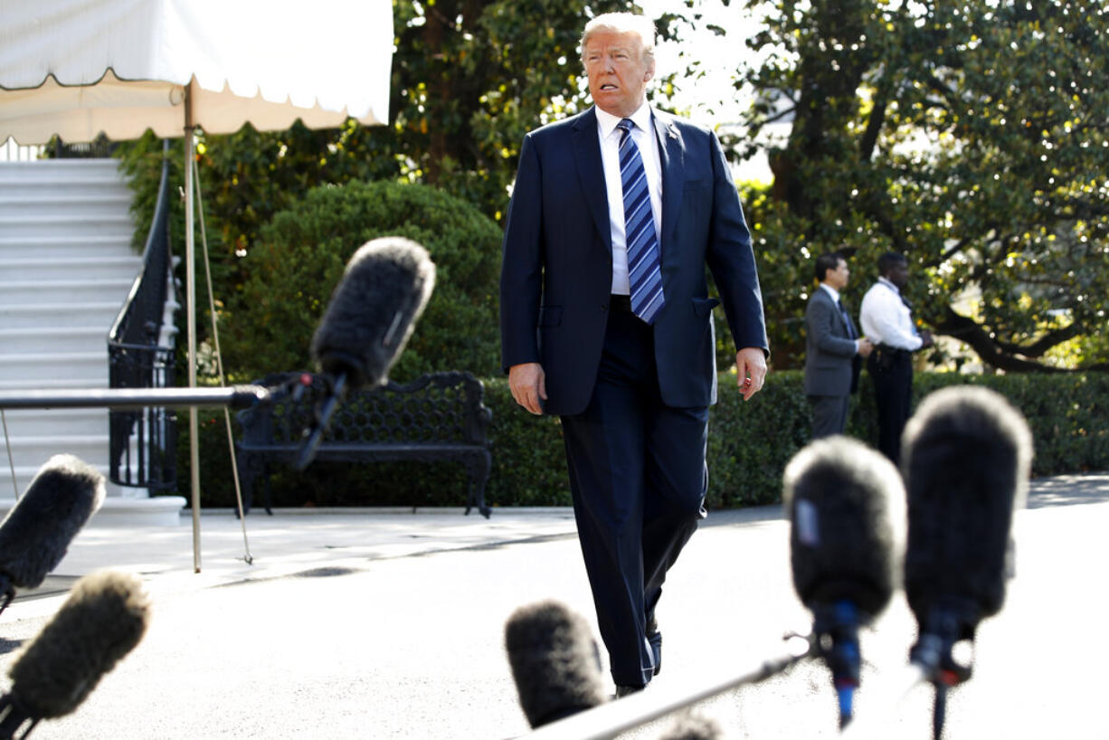 President Donald Trump approaches the microphones to speak to the media as he walks to the Marine One helicopter Friday, May 25, 2018, on the South Lawn of the White House in Washington. Trump is traveling to Annapolis to address the U.S. Naval Academy graduation ceremonies.