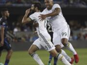 Portland Timbers midfielder Diego Valeri (8) celebrates with forward Samuel Armenteros (99) after scoring a goal against San Jose Earthquakes during the second half of an MLS soccer match Saturday, May 5, 2018, in San Jose, Calif.