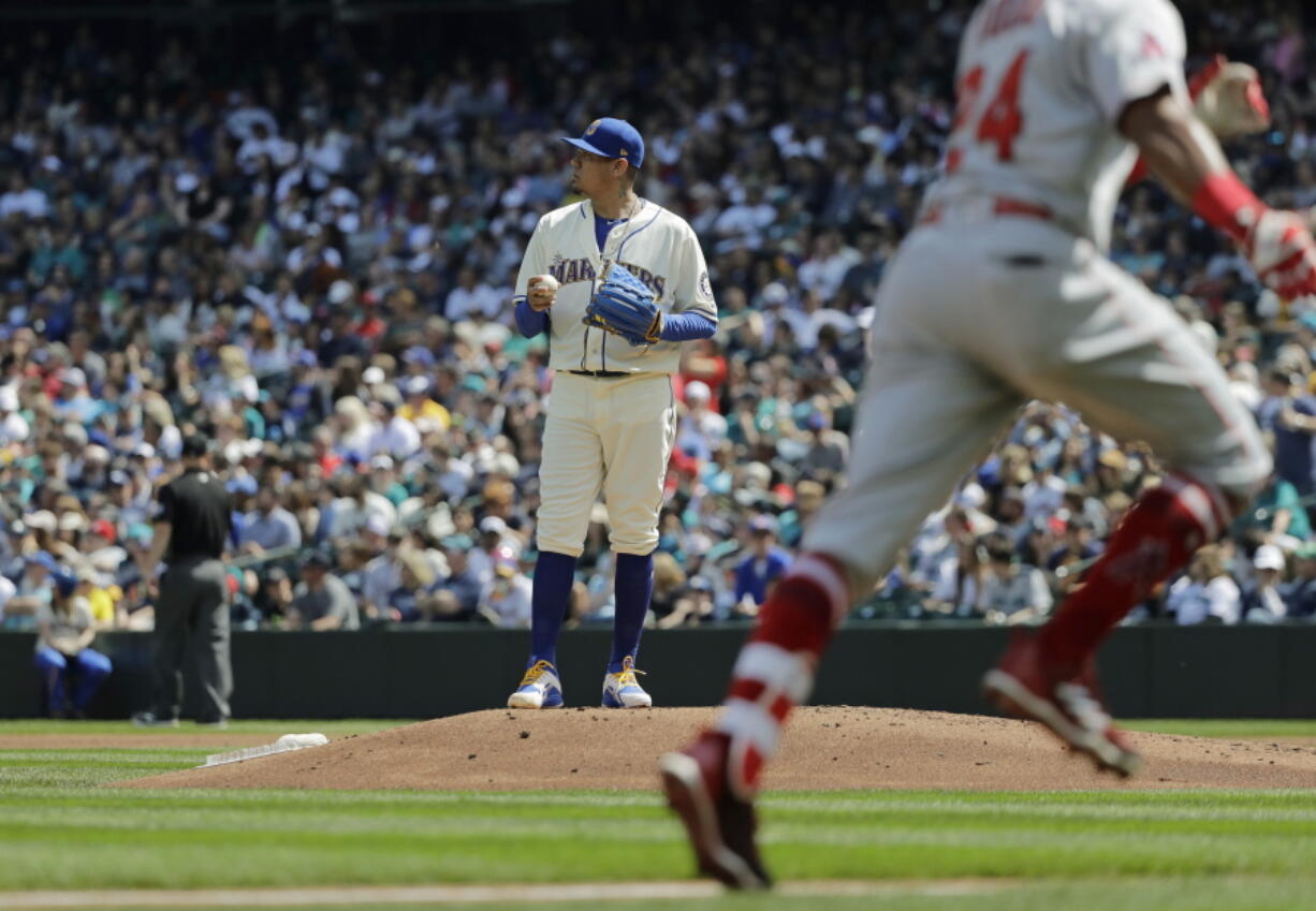 Seattle Mariners starting pitcher Felix Hernandez stands on the mound as Los Angeles Angels’ Chris Young rounds the bases after hitting a solo home run in the second inning of a baseball game, Sunday, May 6, 2018, in Seattle. (AP Photo/Ted S.