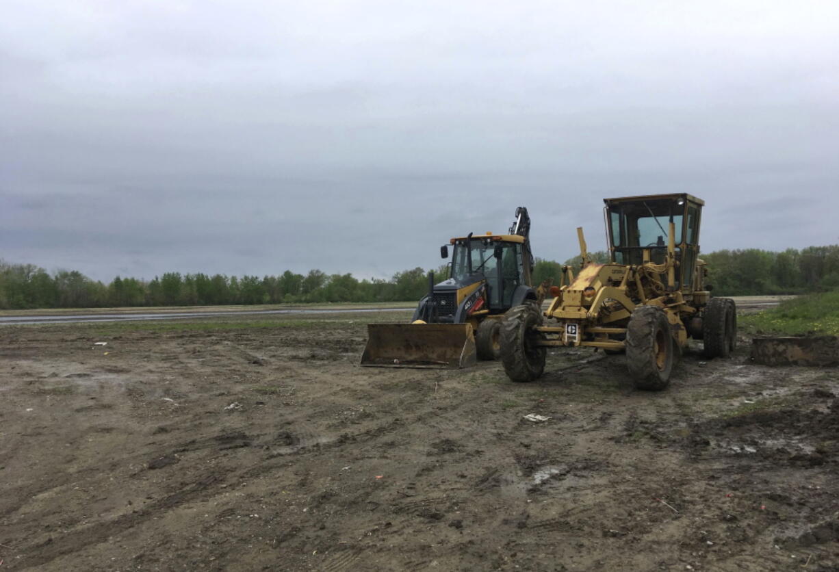 Machinery sits idle in a field in Macomb Township, Mich., on Tuesday. Crews have stopped digging up an area in suburban Detroit where police have said they hoped to find the remains of up to seven missing girls. Warren Mayor James Fouts told The Associated Press on Tuesday that the weeklong excavation on the outskirts of a subdivision in Macomb Township has ended.