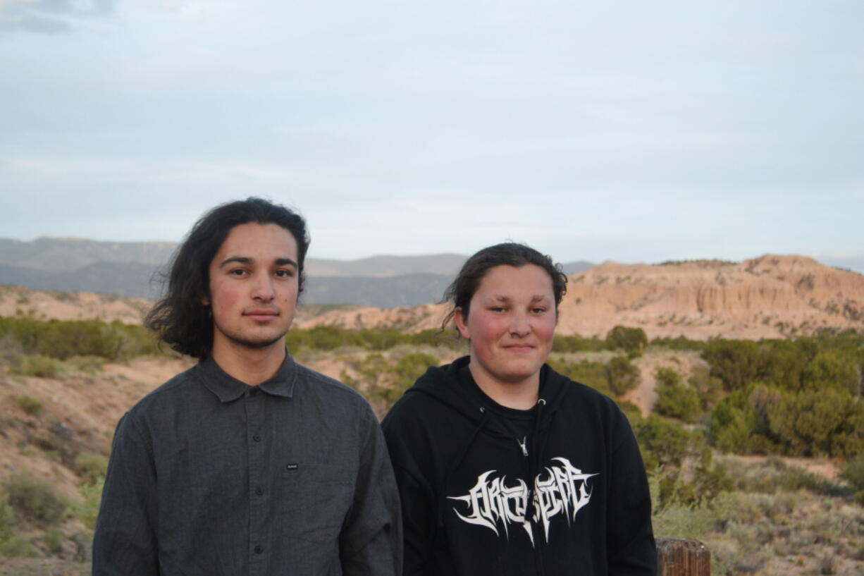 Thomas Gray, left, and Lloyd Gray stand together Friday with the Sangre de Cristo Mountains in the background outside Santa Fe, N.M. The Native American brothers were pulled from a campus tour at Colorado State University on April 30 in an experience that has been decried as yet another example of racial profiling in recent weeks.