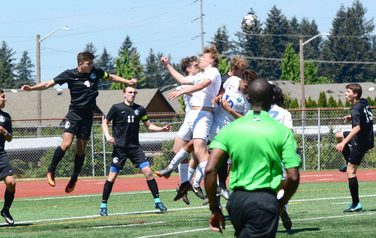 Mountain View's Justin Lifkin-Quandt (4), Joaquin Hernandez (10) and others jump to head a cross during the Thunder's 1-0 extra time win over Bonney Lake in a 3A district winner-to-state game on Saturday, May 12, 2018 at McKenzie Stadium (Andy Buhler/Columbian staff).