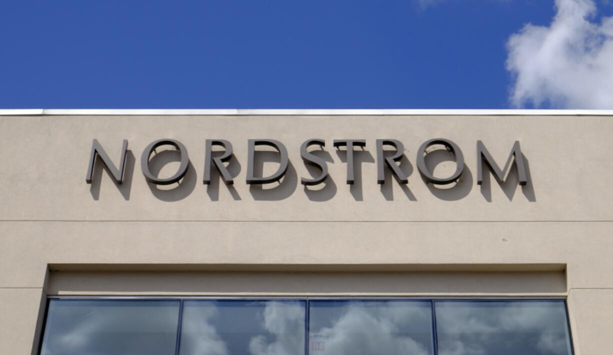 FILE- In this Aug. 23, 2017, file photo, a Nordstrom sign is displayed outside of a mall in Indianapolis. Nordstrom Inc. reports earnings on Thursday, May 17, 2018.