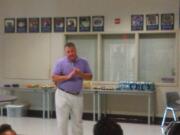 New Heritage boys basketball coach talks to the players during a meet-and-greet at the school on Saturday (Tim Martinez/The Columbian)