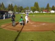 Ridgefield's Brock Harrison stands in the box, awaiting the pitch against Tumwater.