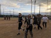 The Woodland Beavers celebrate after a big inning during a 10-5 loss to defending champ W.F.