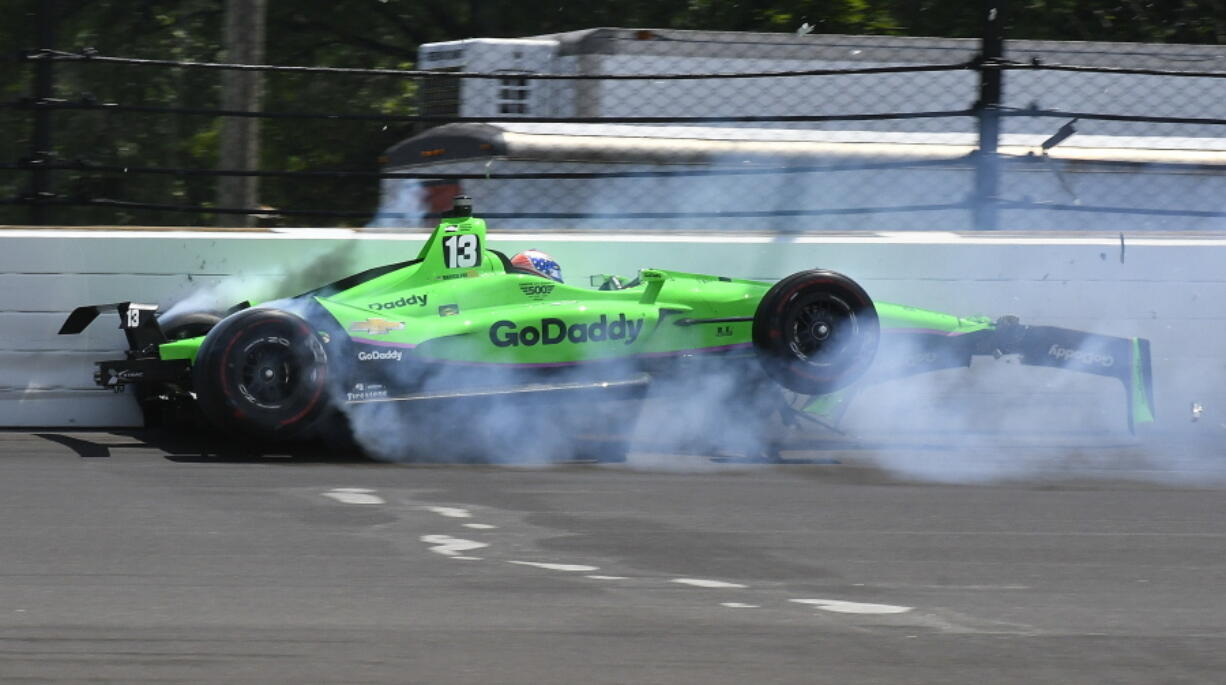 Danica Patrick hits the wall in the second turn during the running of the Indianapolis 500 auto race at Indianapolis Motor Speedway, in Indianapolis Sunday, May 27, 2018.