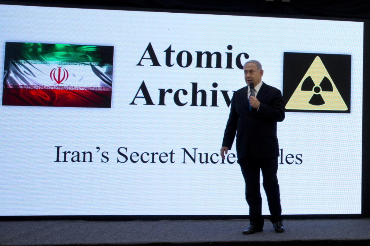 Israeli Prime Minister Benjamin Netanyahu presents material on Iranian nuclear weapons development during a press conference in Tel Aviv, Monday, April 30 2018. Netanyahu says his government has obtained “half a ton” of secret Iranian documents proving the Tehran government once had a nuclear weapons program. Calling it a “great intelligence achievement,” Netanyahu said Monday that the documents show that Iran lied about its nuclear ambitions before signing a 2015 deal with world powers.