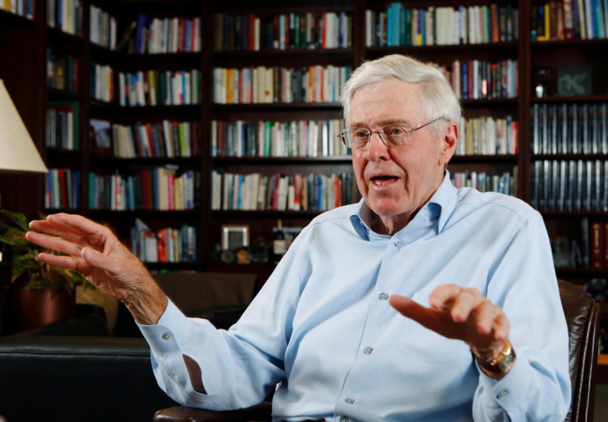 FILE - In this May 22, 2012, file photo, Charles Koch speaks in his office at Koch Industries in Wichita, Kan. The conservative Charles Koch Foundation is dramatically increasing its donations to colleges and universities at a time when its philanthropy is facing increasing scrutiny, according to tax records. The foundation gave nearly $49 million to more than 250 colleges across the U.S. in 2016, according to an Associated Press review of the foundation’s most recent tax records.