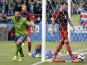 In 2015, Seattle’s Clint Dempsey, left, played a big role in the Sounders' win over the Portland Timbers in Seattle. The Timbers host the Sounders on Sunday in the 100th meeting between the two rivals from the Pacific Northwest. (AP Photo/Ted S.