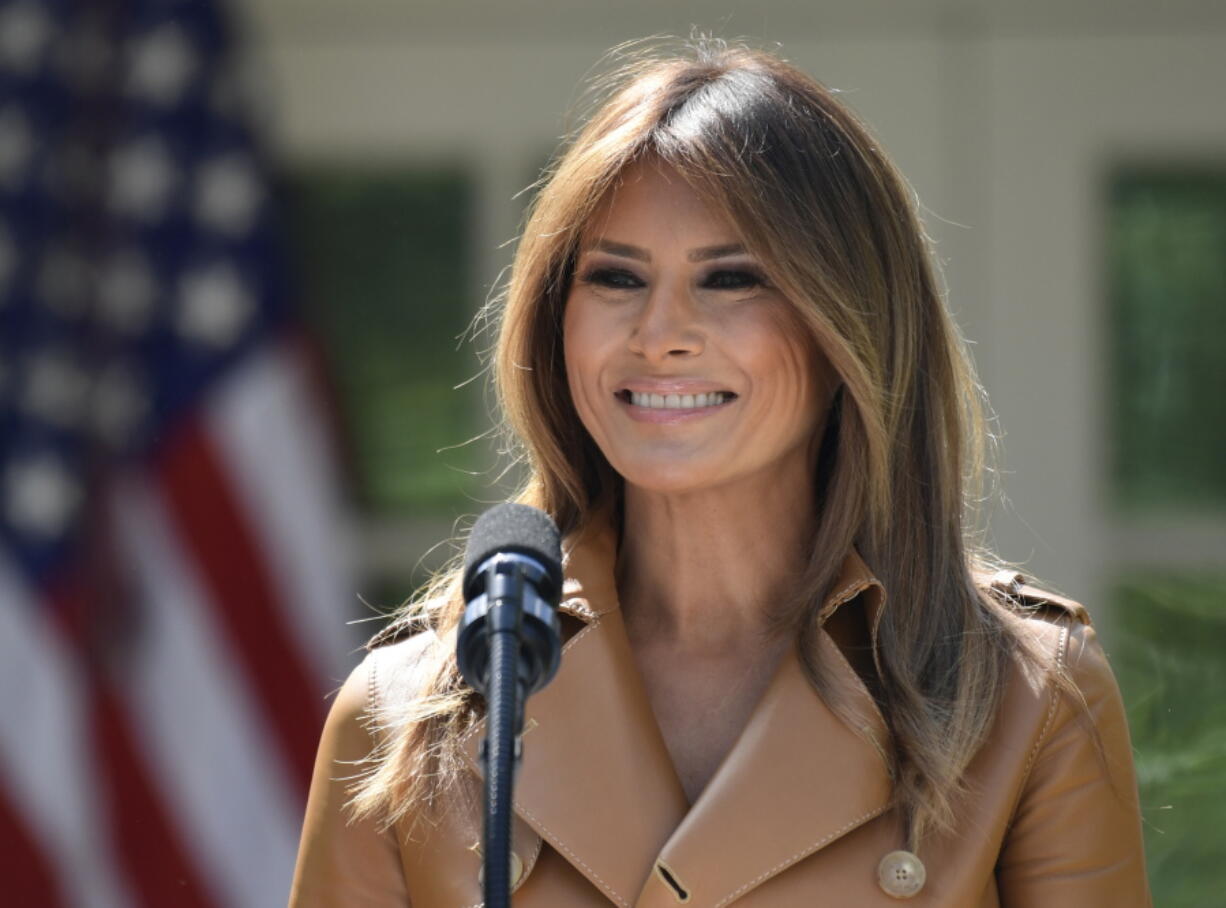 First lady Melania Trump speaks on her initiatives during an event in the Rose Garden of the White House in Washington. The White House says Melania Trump is hospitalized after undergoing a procedure to treat a benign kidney condition.