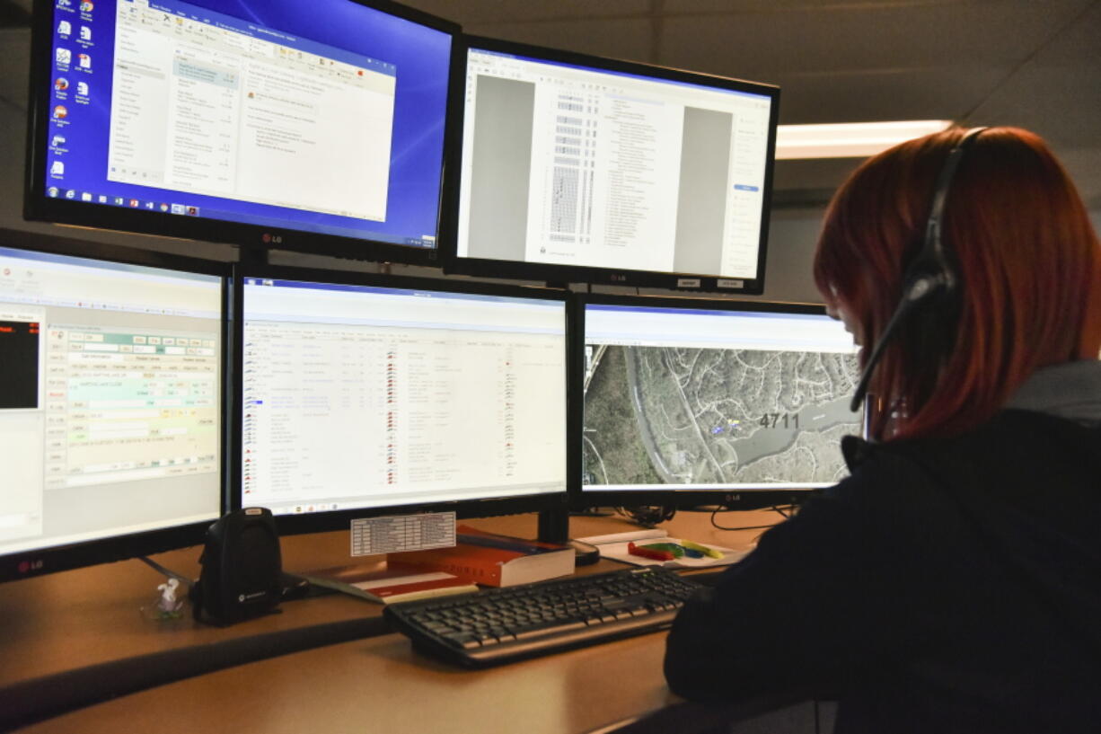 A dispatcher in Roswell, Ga., works with a variety of screens while handling a 911 call. The Roswell call center is one of the few in the United States that accepts text messages. This year is the 50th anniversary of the first 911 call placed in the United States and authorities say it is in desperate need to have its technology modernized.