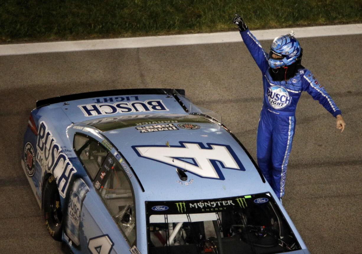 Kevin Harvick (4) celebrates after winning the NASCAR Cup Series auto race at Kansas Speedway on Saturday, May 12, 2018, in Kansas City, Kan.