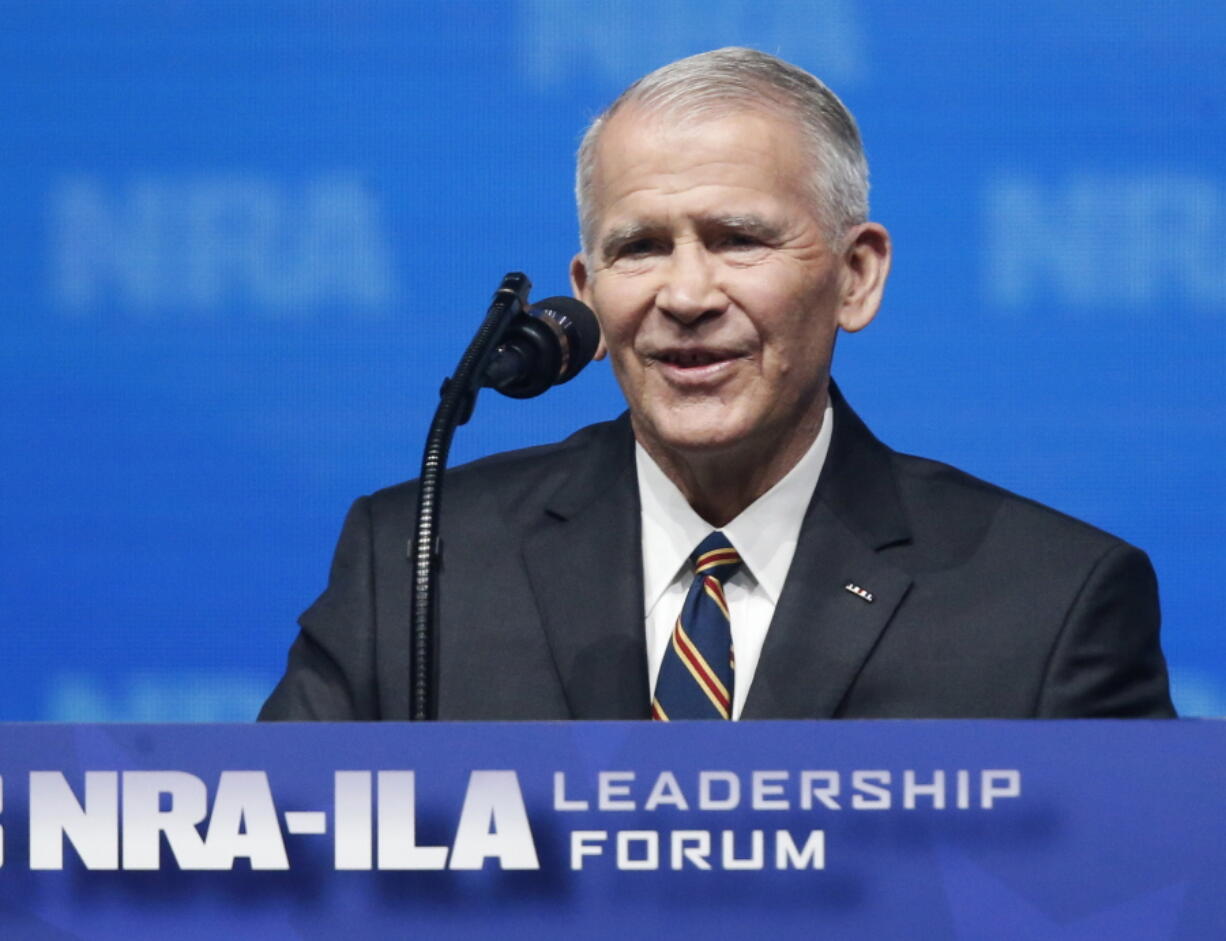 In this May 4, 2018 photo, former U.S. Marine Lt. Col. Oliver North speaks before giving the Invocation at the National Rifle Association-Institute for Legislative Action Leadership Forum in Dallas. The NRA announced today that North will become President of the National Rifle Association of America within a few weeks, a process the NRA Board of Directors initiated this morning.