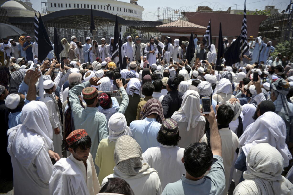 Supporters of the hard-line religious party, Jamiat Ulema Islam, protest against a bill to merge the tribal region along the Afghan border with its territory, at the main entrance of the provincial assembly in Peshawar, Pakistan, Sunday, May 27, 2018. The assembly of the northwestern Khyber Pakhtunkhwa province approved a bill to merge the tribal region with its territory, paving the way to granting equal rights to about 5 million people in the restive area.