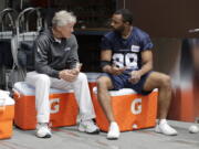 Seattle Seahawks wide receiver Doug Baldwin, right, talks with head coach Pete Carroll, left, following NFL football practice, Thursday, May 24, 2018, in Renton, Wash. (AP Photo/Ted S.