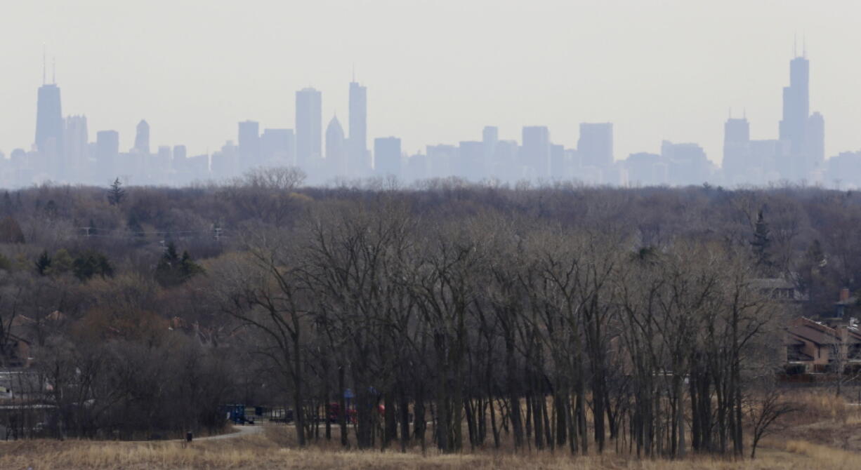 A thick haze of smog looms over the skyline of Chicago in 2015. A new study in the Proceedings of the National Academy of Sciences finds that America’s nitrogen oxides levels, a key ingredient in smog, aren’t falling as fast as they used to and may be leveling off.