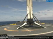 The SpaceX Falcon 9 rocket booster is shown after it landed on a drone ship in the Atlantic Ocean on Friday.