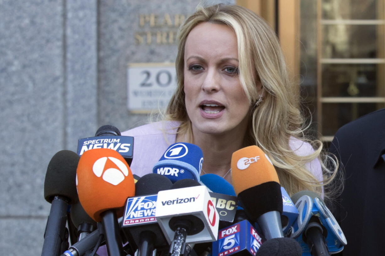 FILE - In this Monday, April 16, 2018 file photo adult film actress Stormy Daniels speaks outside federal court in New York. Daniels is continuing her tour through Oregon after cutting short a performance at a Bend strip club when a man threw a wallet at her face.