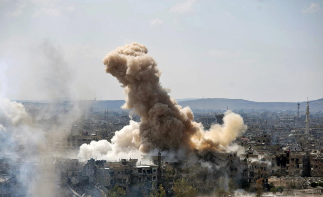 Smoke rises after Syrian government airstrikes and shelling hit in Hajar al-Aswad neighborhood held by Islamic State militants, southern Damascus, Syria. Syria’s military said Monday, May 21, 2018, that it has liberated the last neighborhoods in southern Damascus held by the Islamic State and has declared the Syrian capital and its surroundings “completely safe” and free of any militant presence.