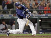 Seattle Mariners' Mitch Haniger doubles in a run against the Detroit Tigers during the seventh inning of a baseball game Friday, May 18, 2018, in Seattle.