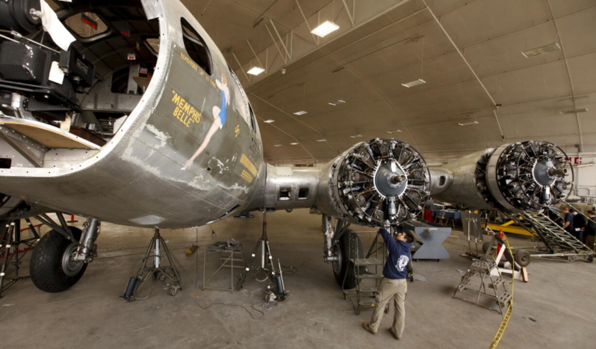 Casey Simmons checks the engine cowl work at the Memphis Belle restoration Feb. 23, 2012, at the National Museum of the U.S. Air Force in Dayton, Ohio. The iconic World War II bomber Memphis Belle is being rolled out at an Ohio museum after a full restoration that has been more than a dozen years in the making. The rehabbed B-17 is being unveiled Thursday at the National Museum of the U.S. Air Force near Dayton.