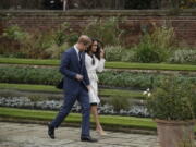 Britain’s Prince Harry and his fiancee Meghan Markle pose for photographers Nov. 27 during a photocall in the grounds of Kensington Palace. Fans of the British royals will want to include castles, Westminster Cathedral and other sites connected to Queen Elizabeth II and her family on any trip to England.