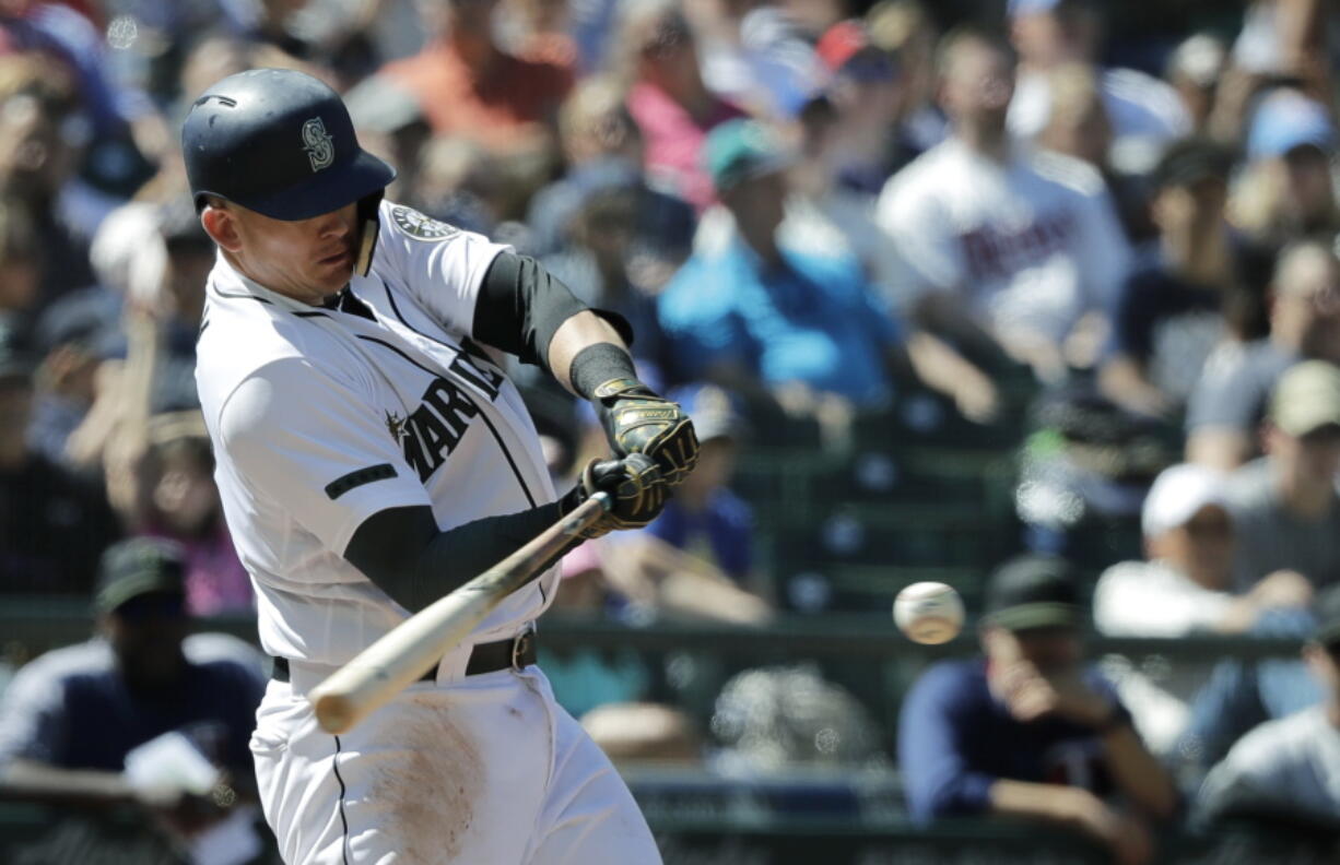 Seattle Mariners’ Ryon Healy hits a two-RBI double in the eighth inning of a baseball game against the Minnesota Twins, Sunday, May 27, 2018, in Seattle. (AP Photo/Ted S.