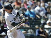 Seattle Mariners’ Ryon Healy hits a two-RBI double in the eighth inning of a baseball game against the Minnesota Twins, Sunday, May 27, 2018, in Seattle. (AP Photo/Ted S.