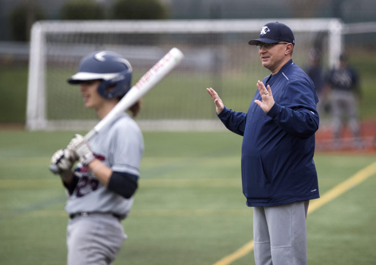 King's Way Christian head coach Gregg Swenson talks with his team during a scrimmage at Luke Jensen Park on Wednesday afternoon, March 7, 2018.