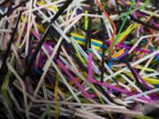 Used flexible drinking straws sit in a bin at the Coca-Cola factory in Dongen, Netherlands.