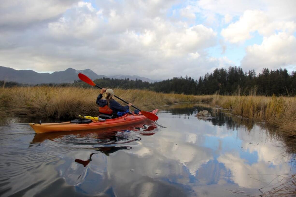 Ginnette Marberry kayaks the mudflats of the Nehalem River on the Oregon Coast in October. A portion of the river qualifies for a “scenic” designation, according to a recent report.