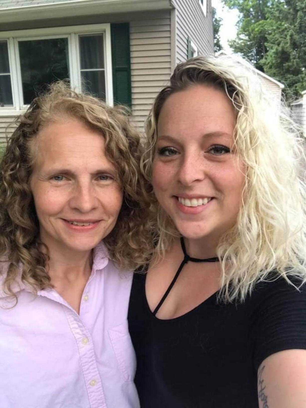 Dawn Johnson, left, with her neighbor and long-lost sister Hillary Harris.