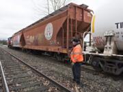 Scott Marshall of Vancouver, engineer and conductor with Portland Vancouver Junction Railroad, switches inbound rail cars at Rye Yard in January.