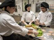 Workforce Southwest Washington is looking for ways to help what it calls “opportunity youth” to receive training to join local industries. For example, Cascadia Technical Academy juniors, from left, Sergey Revenko, Alissa Garon and Miguel Rodriquez are in a culinary arts program in Vancouver.