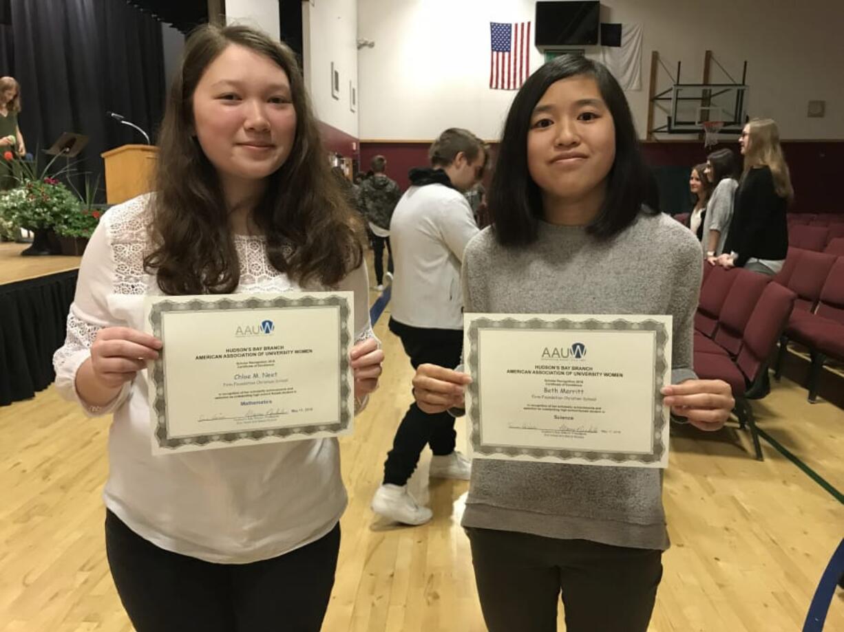 Battle Ground: Firm Foundation Christian School sophomores Beth Merritt, left, and Chloe Neet received Scholar Recognitions by the Hudson’s Bay branch of the American Association of University Women for their achievement in math and science.