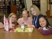 Washougal: Washougal High School advanced baking students created book-themed cakes in honor of National Library Week. Rose Elsensohn, from left, Rebecca McDonald, Hannah Moen and Jennifer Whitmeyer baked an “Alice in Wonderland” cake, which students at the school voted as their favorite.