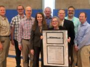 Brush Prairie: The new Hockinson Middle School was dedicated at a ceremony on May 9. From left: School board Director Dave Olson, Bryan Kenney with Robinson Construction, Matthew Braun with DOWA-IBI Group, Superintendent Sandra Yager, district construction manager Damon Rochè, Board Chairwoman Kathy Nordberg and School board directors Greg Gospe, Gordon Smith and Steve Nylund.