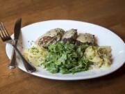 The Bavarian Meatballs served with German potato salad and fresh greens at Gustav’s in Vancouver.