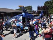 People crowd around the Lifeflight helicopter at the Clark County Fire District 6 open house.