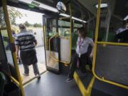 Gateway to Adult Transition Program student Harmony Steffen, center, exits the bus Friday morning after riding to the Marshall Community Center using the Youth Opportunity Pass.