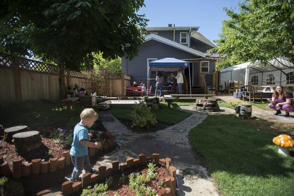 Sixteen-month-old Caspian Ferraris explores the landscaped backyard at the Wattle Tree Place, a New Age coffeehouse and wellness center in downtown Vancouver. But despite earning the Best New Business of the Year award from Vancouver’s Downtown Association, Wattle Tree will have to move before the end of this year, since the owner of its block plans to build apartments here.