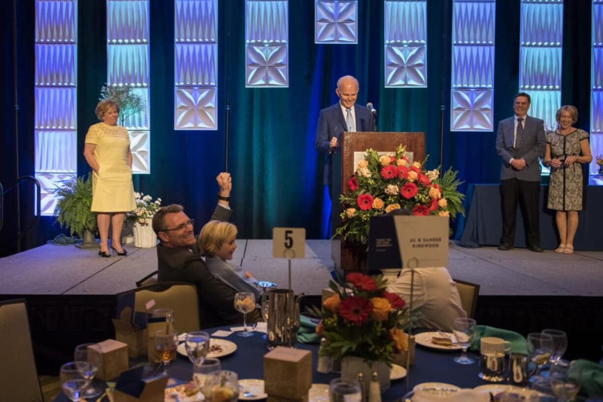 Al Kirkwood, center, supported by his wife Sandee, left, said they were “very honored, very grateful and very blessed” to the accept the 2018 Philanthropists of the Year award.