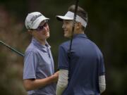 Graham Moody, left, and Cade Bringhurst take a moment to chat before teeing off on the fourth hole during the Royal Oaks Invitational at Royal Oaks Country Club on Friday afternoon, June 8, 2018.