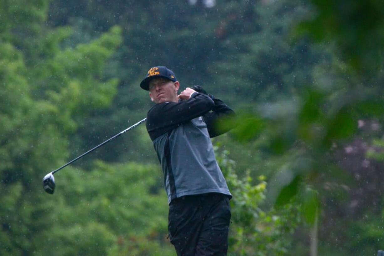 Robbie Ziegler tees off through the rain drops on the 14th hole during the final day of the Royal Oaks Invitational Tournament. Ziegler, the defending champion, fired a 4-under-par 68 on Sunday to win the tournament by four shots.