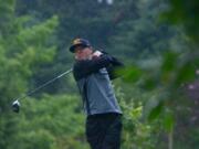 Robbie Ziegler tees off through the rain drops on the 14th hole during the final day of the Royal Oaks Invitational Tournament. Ziegler, the defending champion, fired a 4-under-par 68 on Sunday to win the tournament by four shots.