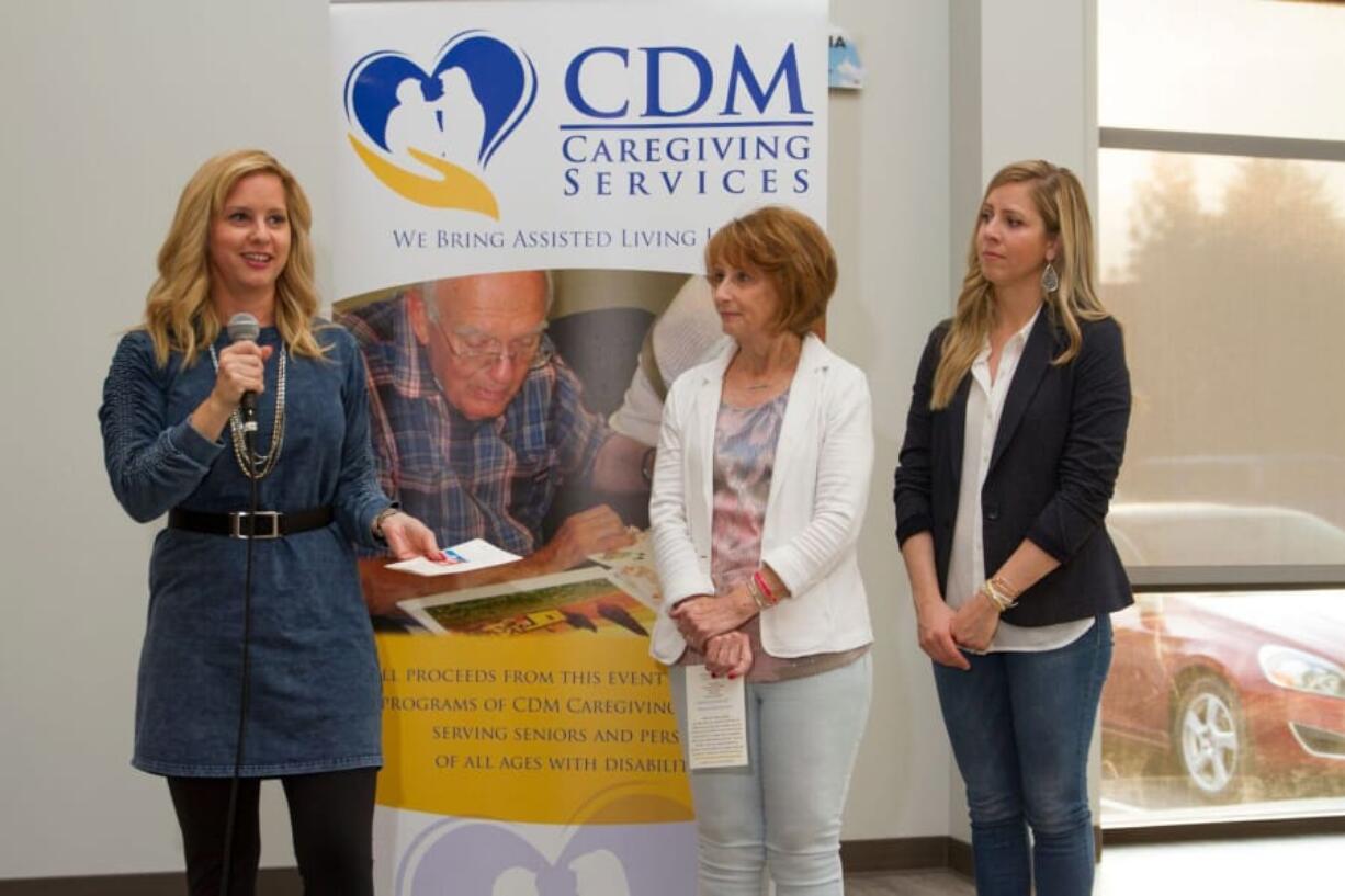 Meadow Homes: Jennifer McKibbin, from left, Nancy McKibbin and Megan McKibbin talk at a ceremony unveiling the CDM Caregiving Services’ new adult day center, named for John McKibbin, the community leader who died in a 2016 plane crash.