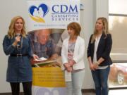 Meadow Homes: Jennifer McKibbin, from left, Nancy McKibbin and Megan McKibbin talk at a ceremony unveiling the CDM Caregiving Services’ new adult day center, named for John McKibbin, the community leader who died in a 2016 plane crash.